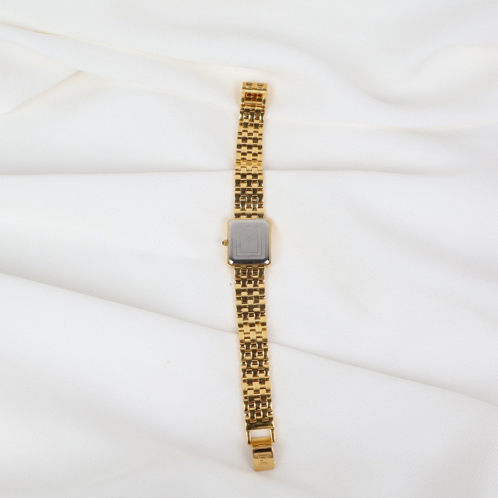 Vintage Gold Christian Gold Watch with a Rectangle Face