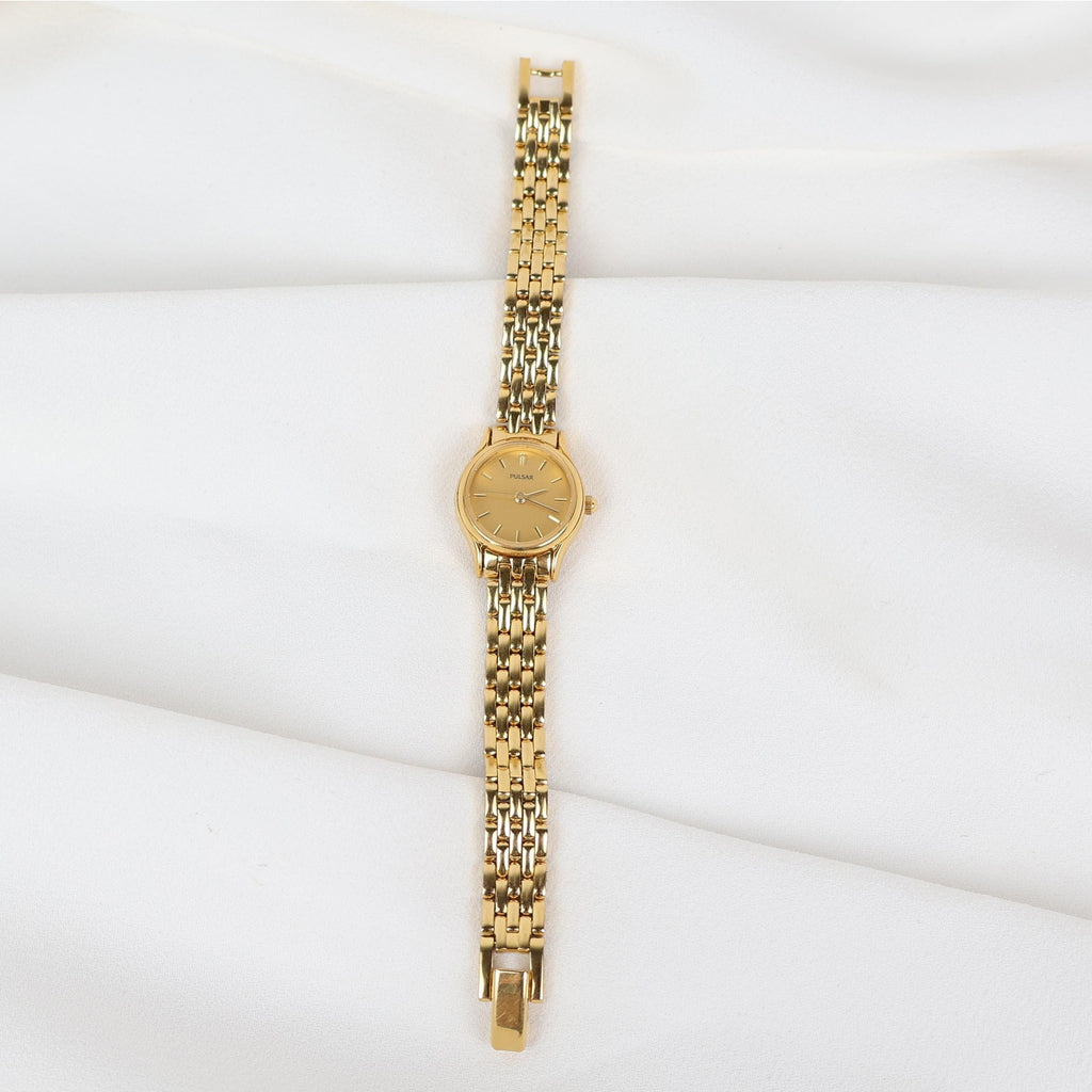 Vintage Gold Tone Pulsar Watch with a Circle Face
