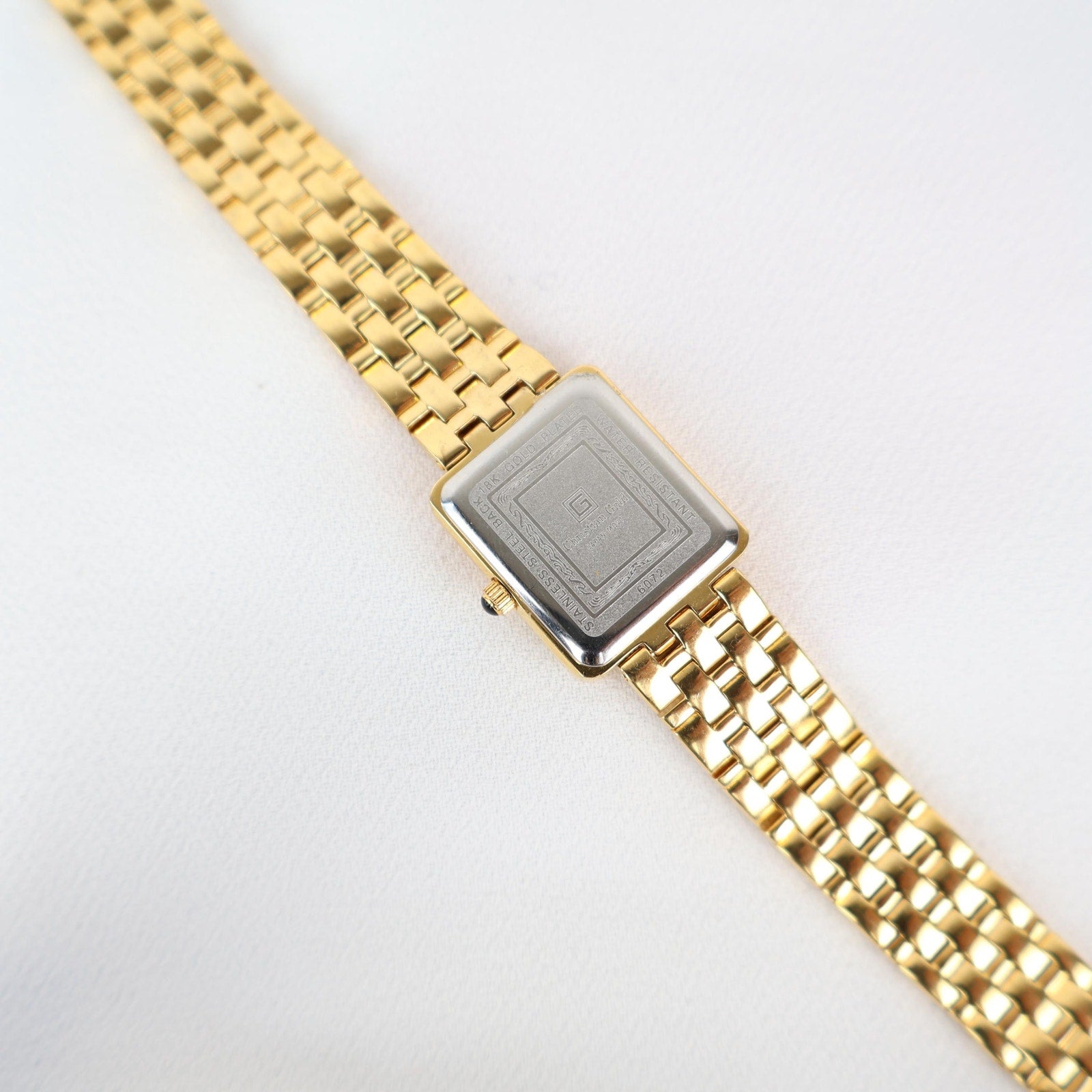 Vintage Gold Christian Gold Watch with a Rectangle Face