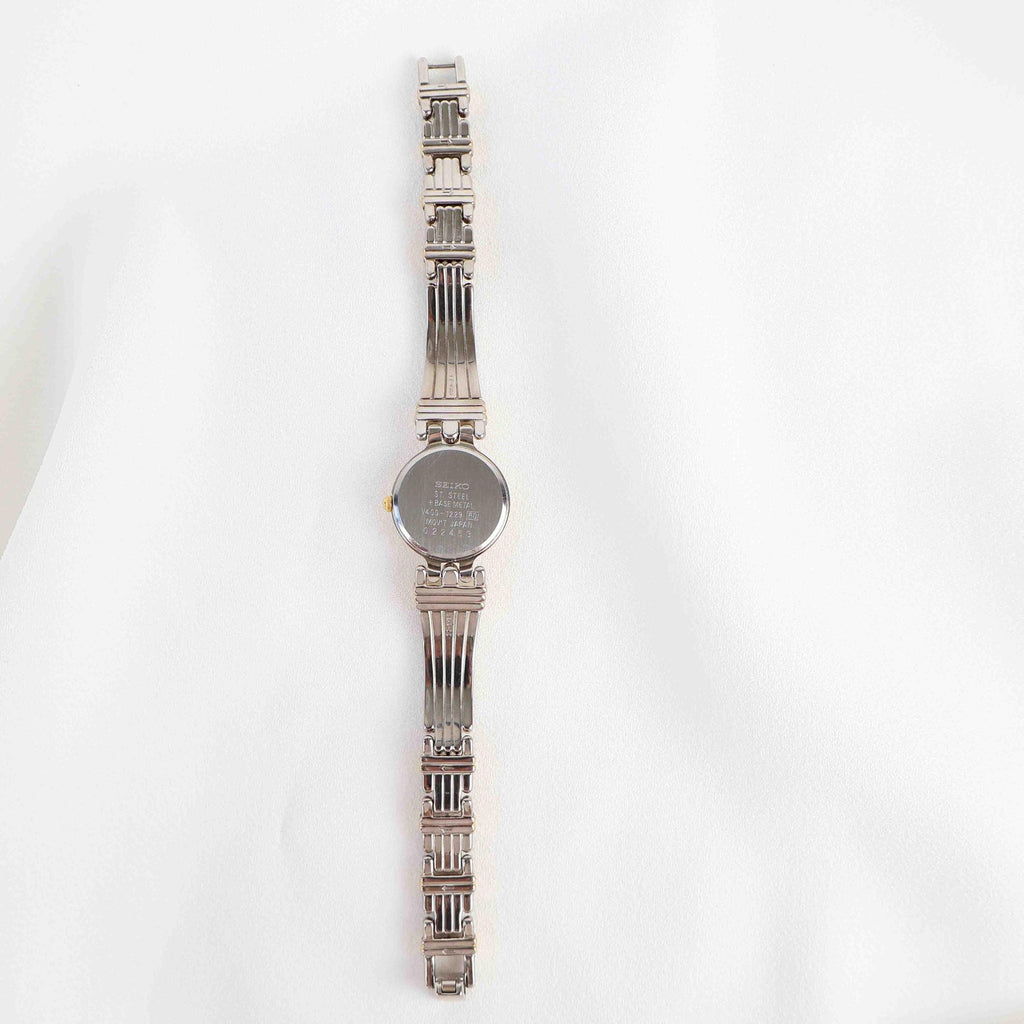 Vintage Two Tone Seiko with a White Round Face - (Working Battery)