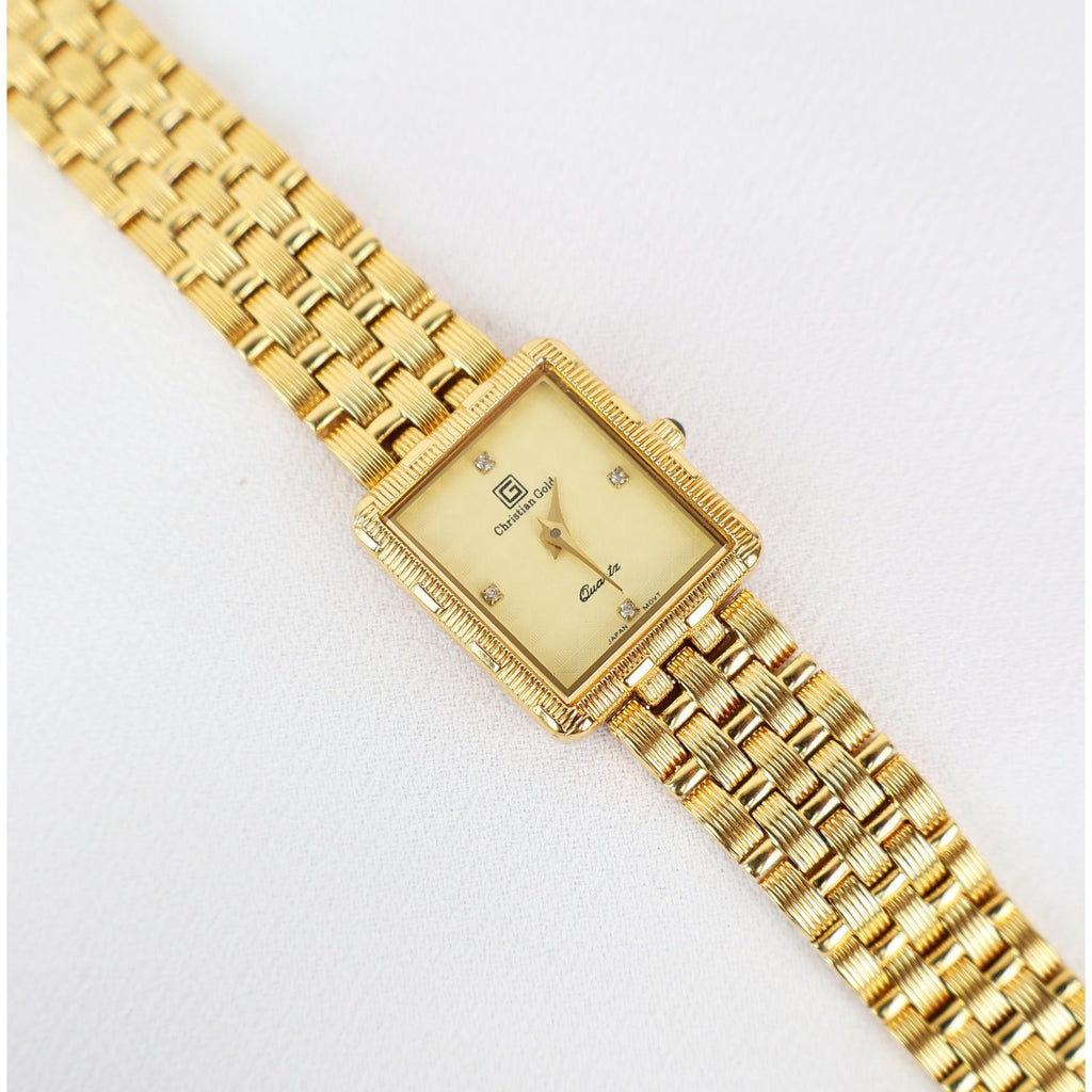 Vintage Gold Christian Gold Watch with a Rectangle Face