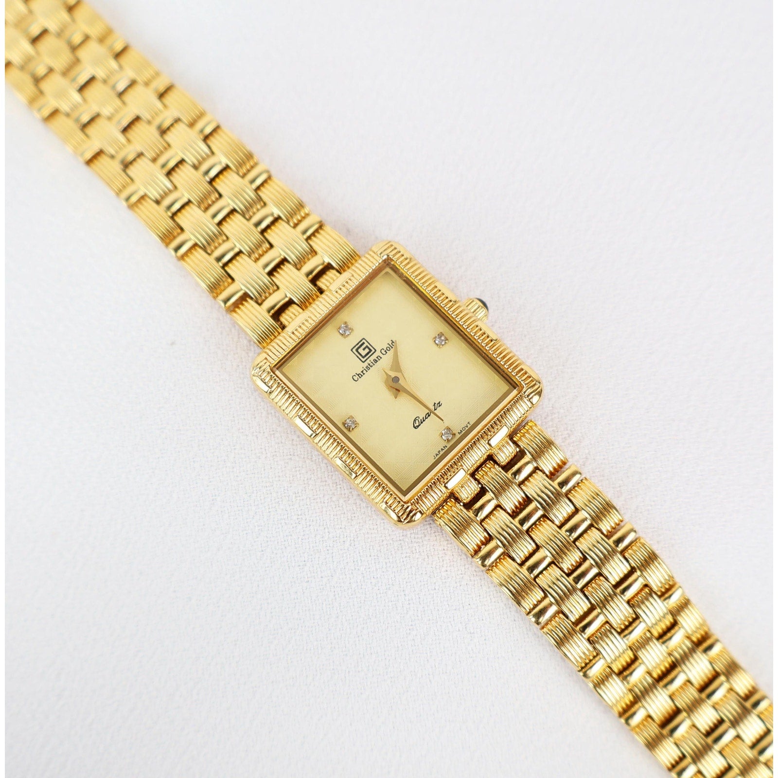 Vintage Gold Christian Gold Watch with a Rectangle Face