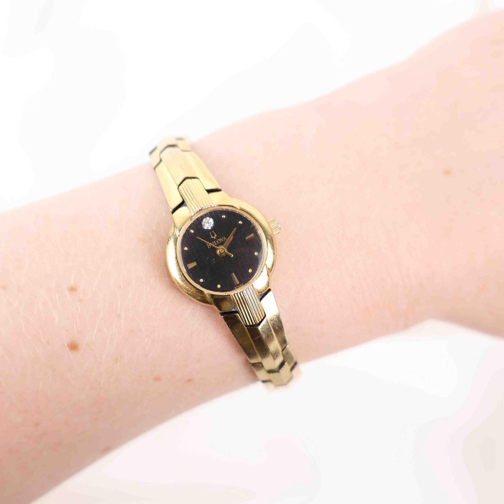 Vintage Bulova Black Face Watch – Gold Tone Bracelet (Working Battery)
