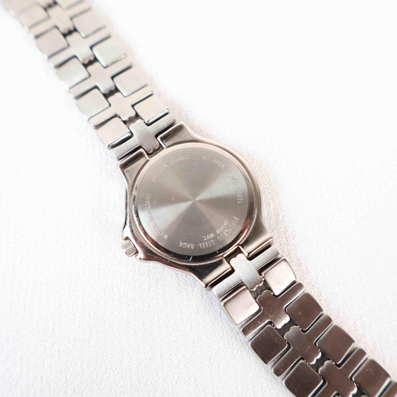 Vintage Silver Tone Bulova Watch with Round White Watch Face