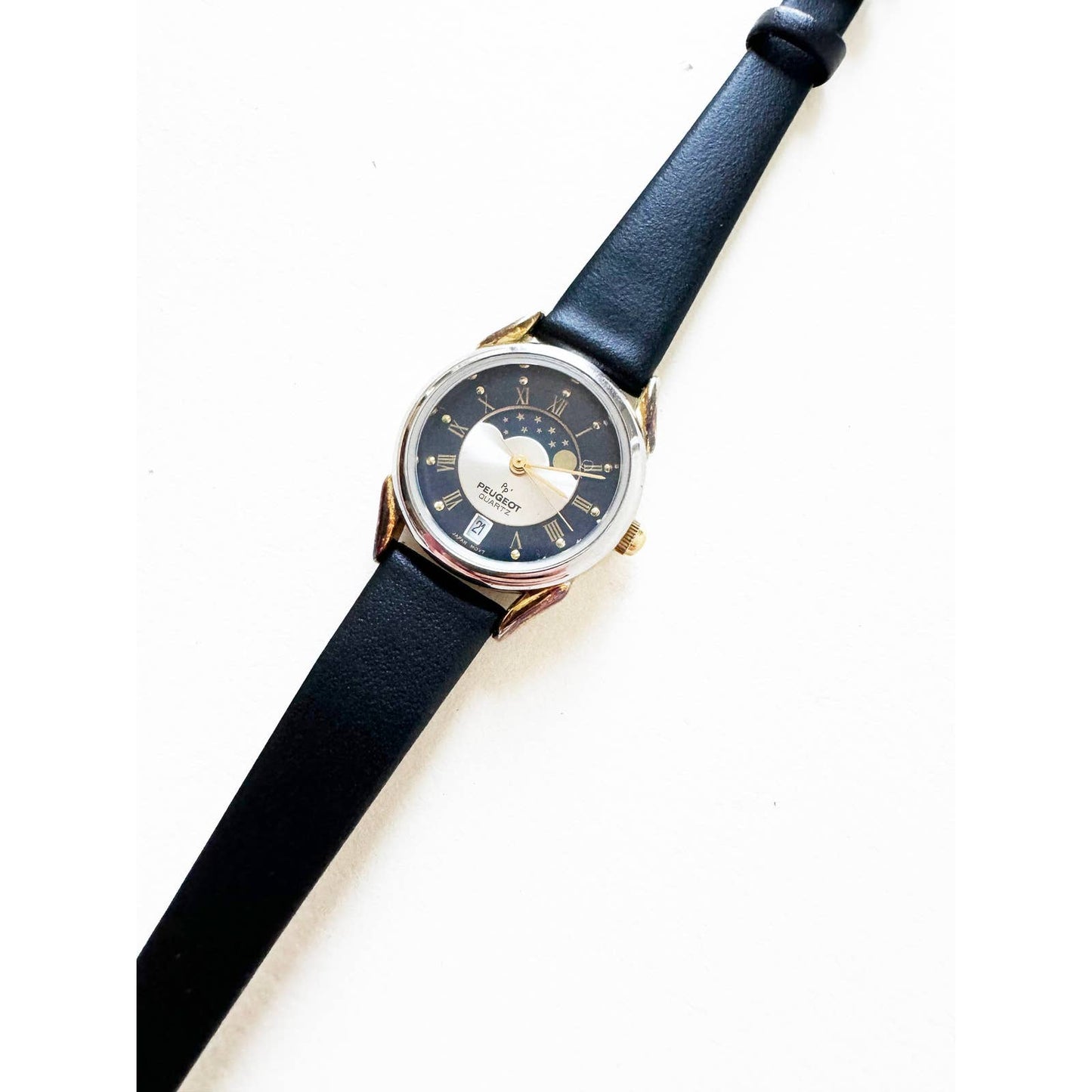 Vintage Leather Watch with Black Band and Silver Details and Sky | Peugeot