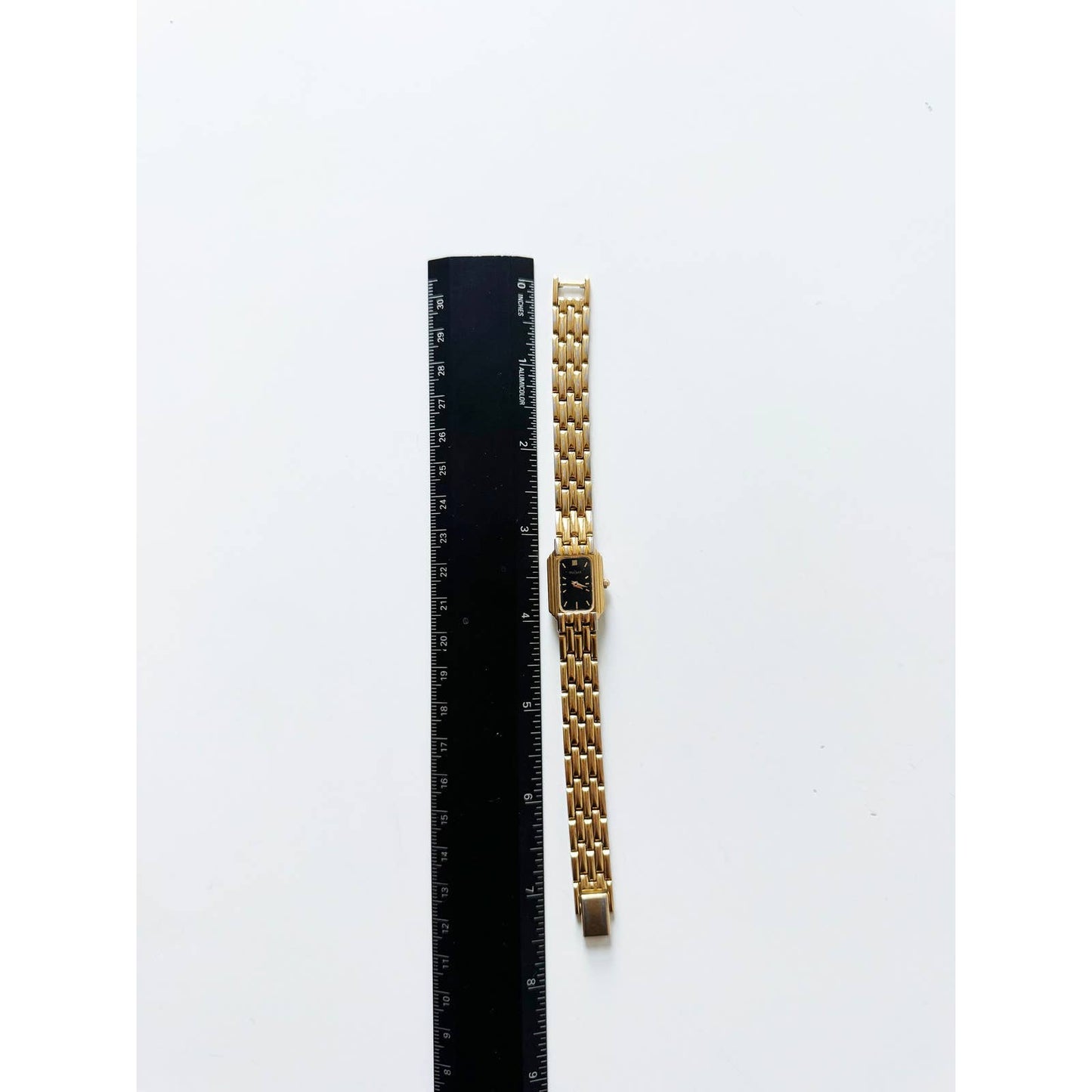Vintage 90s Small Black and Gold Watch with Rectangular Face | Pulsar